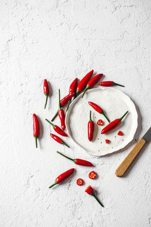 Sfondo fotografico in vinile 'Latte' con superficie opaca e texture liscia, tono neutro caldo che richiama l'intonaco bianco e ruvido. Ideale per fotografie di food